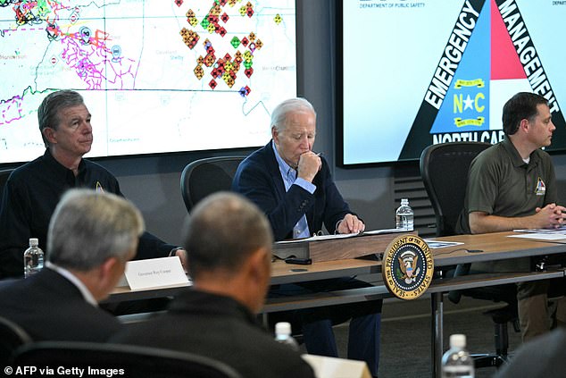 US President Joe Biden (center) and North Carolina Governor Roy Cooper (left) receive an operational briefing at the Emergency Operations Center in Raleigh.