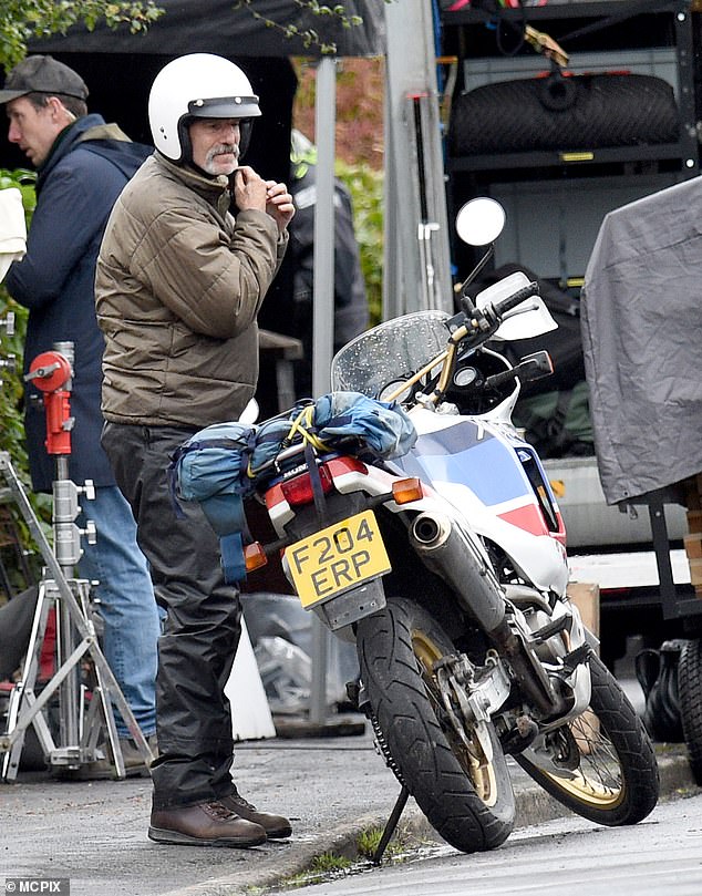 Daniel Day Lewis looked unrecognizable with a beard and mustache as he was filmed riding a motorcycle with fellow star Sean Bean.