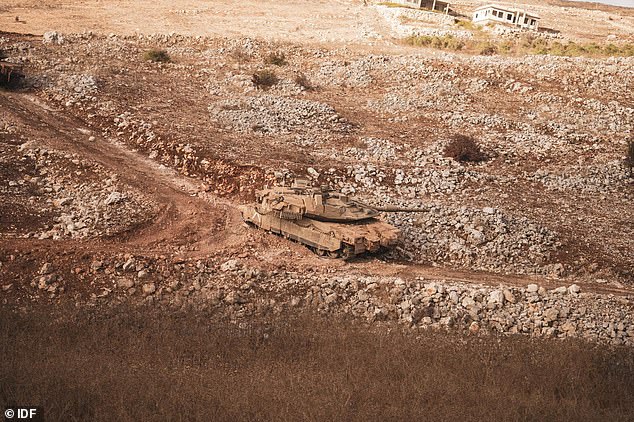 An Israeli tank is seen advancing towards southern Lebanon