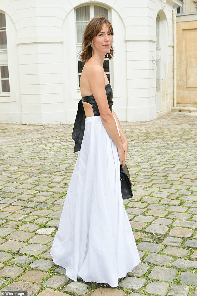 Rebecca Hall showed off her lithe physique in a stunning dress that featured a strapless black leather bodice and a long white skirt.