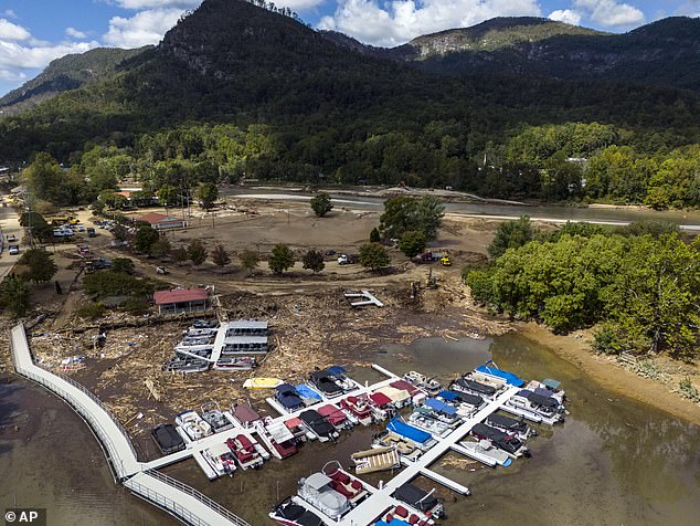 In this drone image, a marina is drowned by debris after Hurricane Helene, Wednesday, Oct. 2, 2024, in Lake Lure.