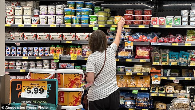 A customer looks at refrigerated items at a Grocery Outlet store in Pleasanton, California.