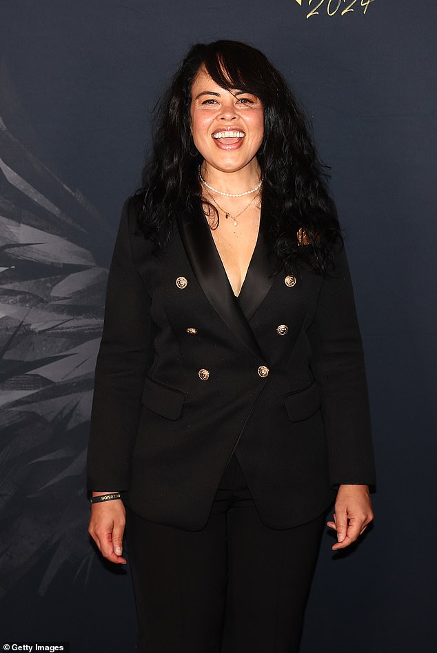 Karen Lee Andrews, 42, (pictured), formerly known by her stage name Mrs Murphy, opted for a sleek black coat with gold buttons for the musical event.