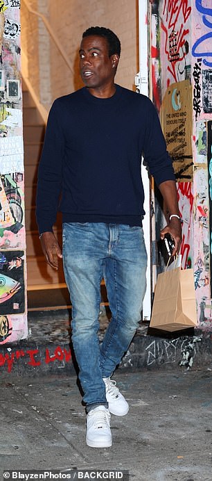 Meanwhile, comedian Chris Rock, 59, wore a navy sweater with blue jeans for the occasion.