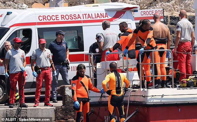 Rescuers wait after recovering the body of Hannah Lynch off the coast of Porticello