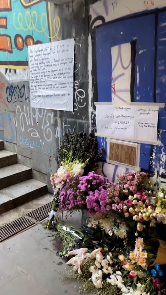 Floral tributes have since appeared at the site of the tragedy, in Tbilisi's Republic Square, alongside a sign written in English stating that the height of the wall meets building regulations.