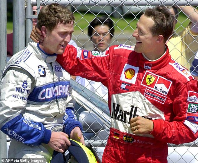 Ralf and his brother, Formula One legend Michael Schumacher (right), celebrate together after the Canadian GP in 2001.