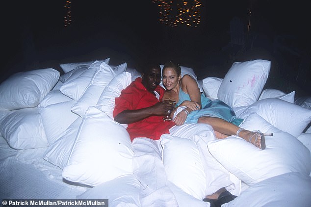 Sean 'Diddy' Combs with his then-girlfriend Jennifer Lopez at one of his famous White Parties at his East Hampton mansion, this time held on July 2, 2000.