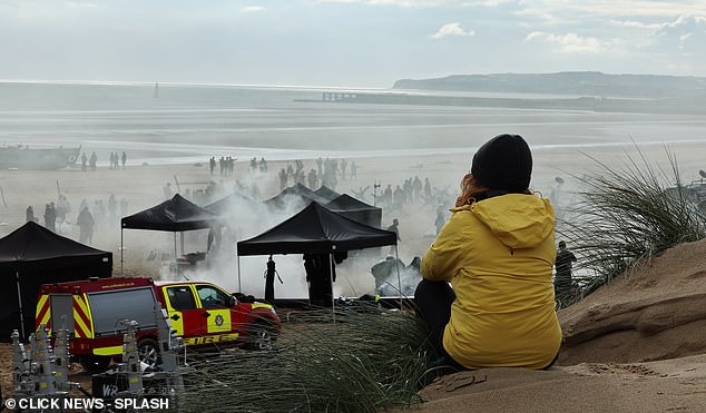 Locals watched from the sandbanks as the team got to work.