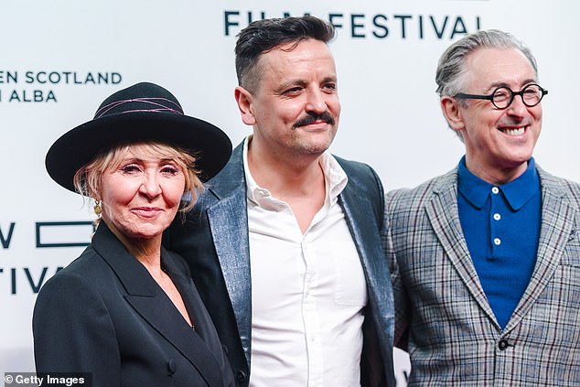 Jono is a filmmaker recognized by BAFTA Scotland for his work (pictured with Lulu and Alan Cummings in 2022 at the premiere of My Old School).