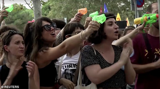 Protesters fired water guns at tourists eating at popular Barcelona spots in July.