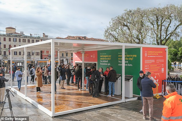 Pictured: A ticket office where tourists can buy a day pass to Venice, seen on April 25.