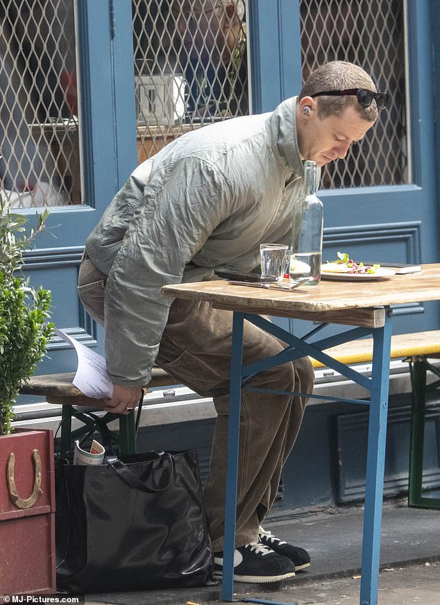 Jospeh dined outdoors and brought a book for the company.