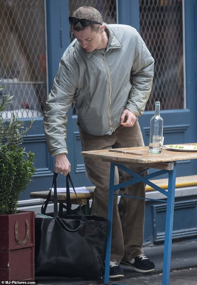 The star, who plays Eddie Munson in the Netflix series, carried her essentials in a £510 Acne Studios tote bag.