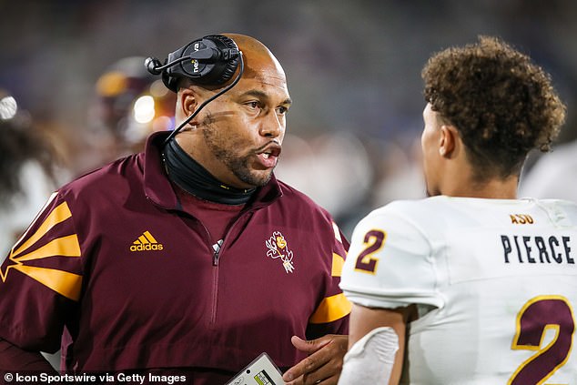 Arizona State Sun Devils coach Antonio Pierce talks with his son, DeAndre Pierce