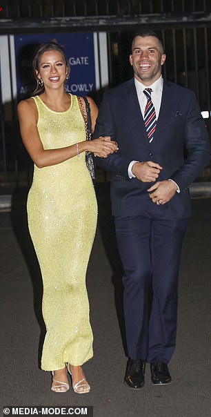 Team captain James Tedesco's wife, Maria Glinellis, surprised with a bright lemon-colored dress