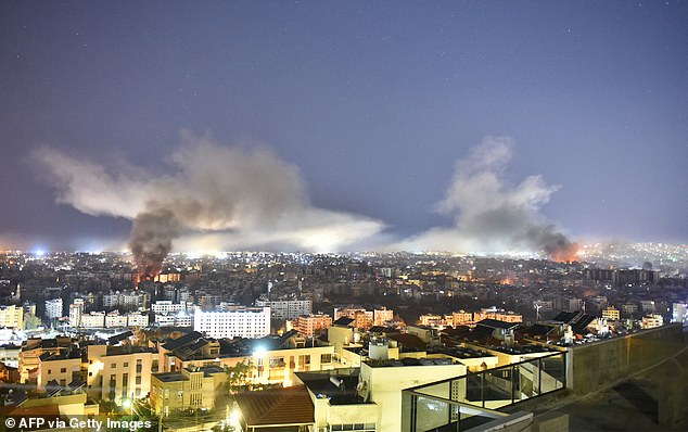 Smoke rises from the site of an Israeli airstrike that targeted a neighborhood in Beirut's southern suburb on Thursday.