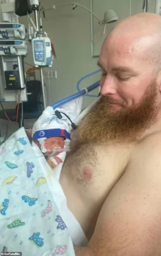 Luna (pictured with her dad Scott) didn't meet her mom until she was eight days old.