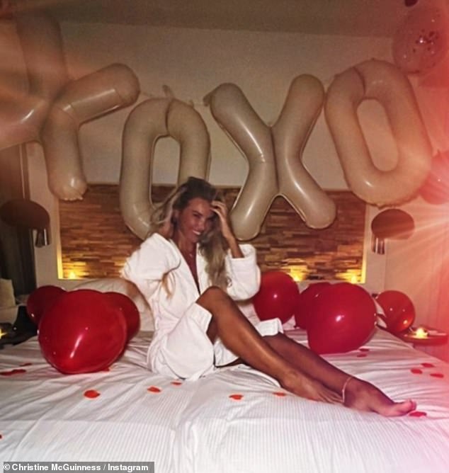 She recently returned home from a sun-soaked romantic getaway in Ibiza, and shared photos of herself lounging on a bed covered in rose petals, candles and balloons, while her date remained a mystery.