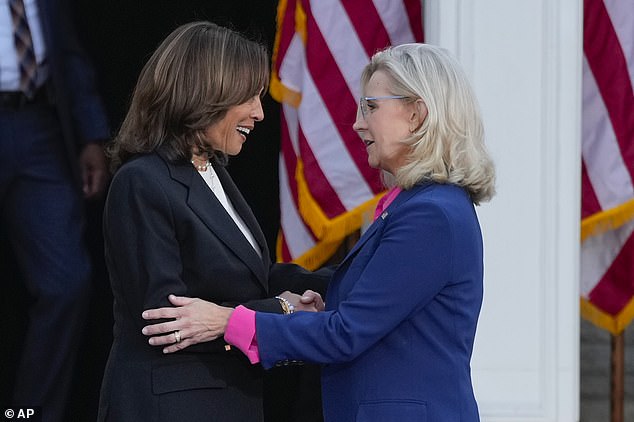 Democratic Vice President Kamala Harris (left) and former Republican Rep. Liz Cheney (right) greet each other on stage during a campaign event at Ripon College in Ripon, Wisconsin. Ripon is the birthplace of the Republican Party