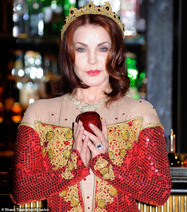 Priscilla Presley poses as the Evil Queen during a photo call for Snow White and the Seven Dwarfs at the New Wimbledon theater in 2012.