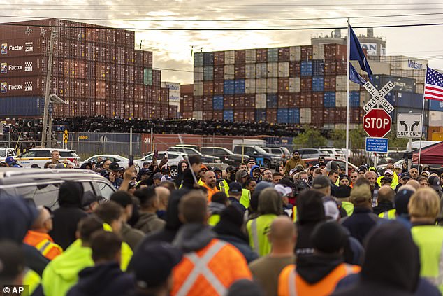 Workers participate in a dock strike at Port Newark, Tuesday, Oct. 1, 2024, in Bayonne, New Jersey.