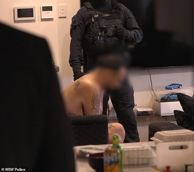 Bargshoon in custody after his arrest by police from the State Crime Command's heavily armed Organized Crime Squad, who dragged him out of the unit in only his underwear.