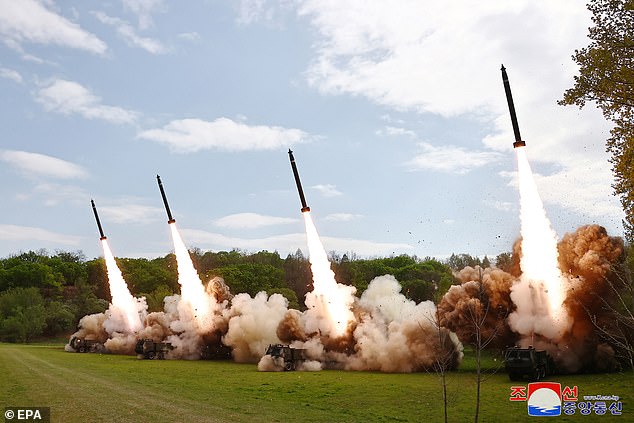 A photograph released by North Korea's official Korean Central News Agency (KCNA) shows missiles launched during a nuclear counterattack drill at an undisclosed location in April.