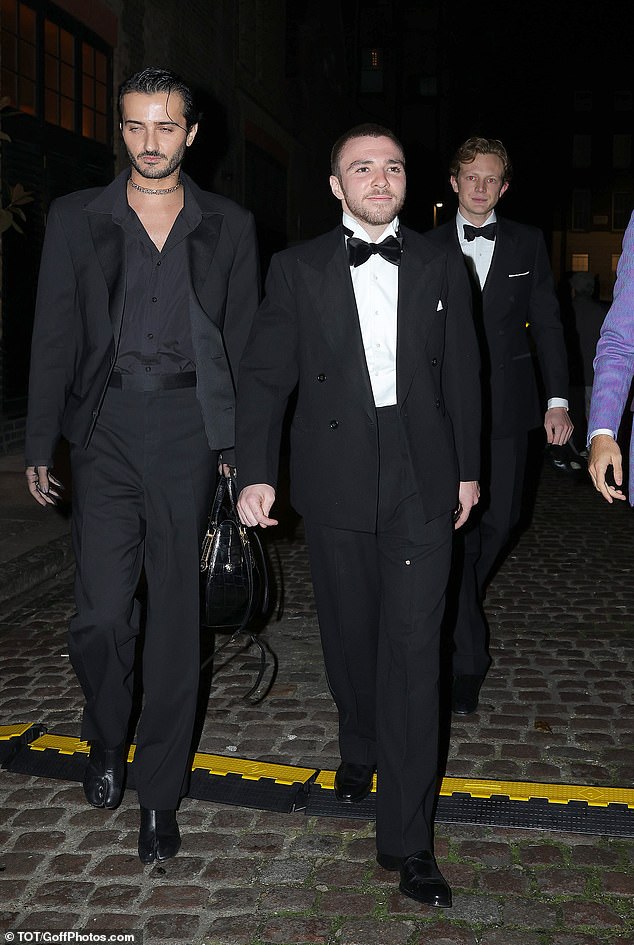 The 24-year-old son of Madonna and Guy Ritchie wore a smart matching suit with a double-breasted jacket as he left the venue early in the morning with a group of friends.