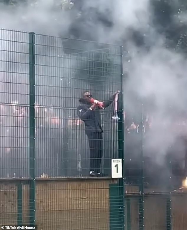 One of the PSG ultras, who was seen standing on a wall, led chants through a megaphone