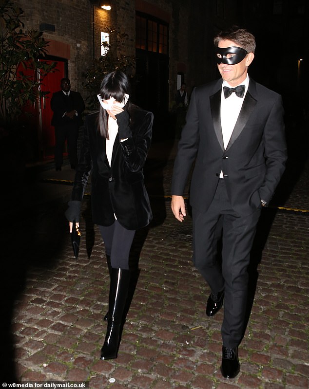 Keeping with the event's masquerade theme, she and Kris sported matching masks as they headed to the party.