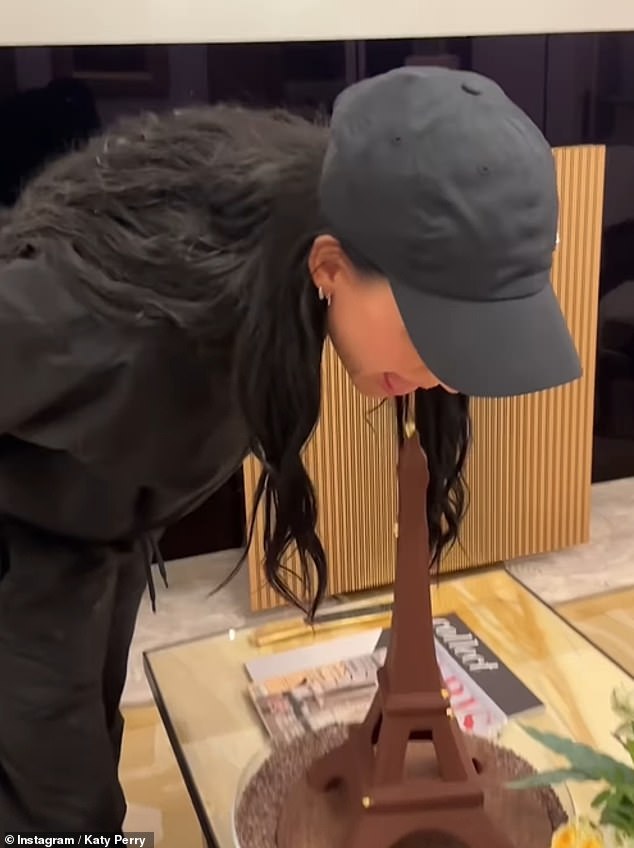 In the context-free clip, which was posted to her Instagram Story on Friday, the 39-year-old singer leaned over with her hands behind her back to bite into the top of a sweet creation from the famous landmark.