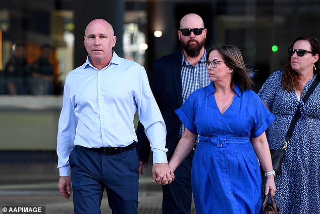 Brother Ian Cabrie (left) and his best friend Cameron Thomas (second left) emerge to speak to the media outside the Supreme Court in Brisbane on Friday.