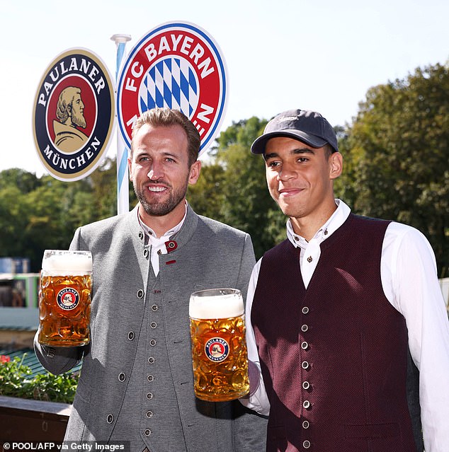 England's Harry Kane and Bayern Munich's Jamal Musiala celebrate Oktoberfest on September 22