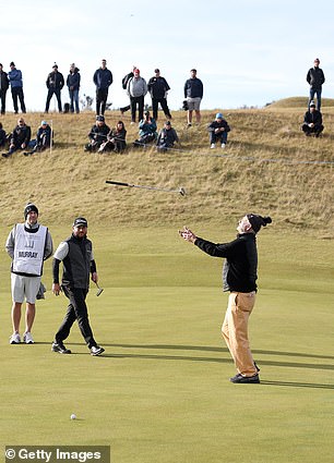 The star threw his golf club into the air to celebrate a good swing