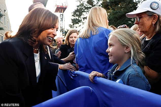 Kamala Harris speaking to a girl at her rally in Ripon, Wisconsin, on October 3, 2024.