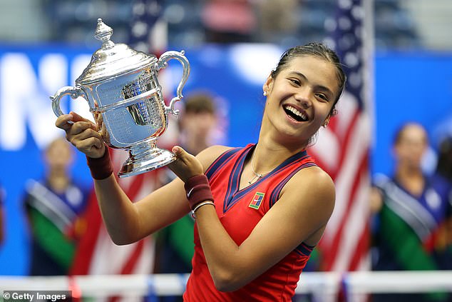 Emma Raducanu celebrates with the championship trophy after defeating Leylah Annie Fernandez during their women's singles final match on day thirteen of the 2021 US Open.