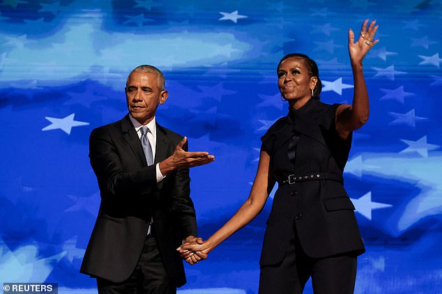 Former first couple Barack and Michelle Obama on stage at the Democratic National Convention in Chicago in August. DailyMail.com poll found his endorsement of Harris had the biggest effect