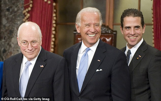 Vice President Dick Cheney, Vice President-elect Joe Biden and his son Hunter Biden pose for photos at the Capitol.