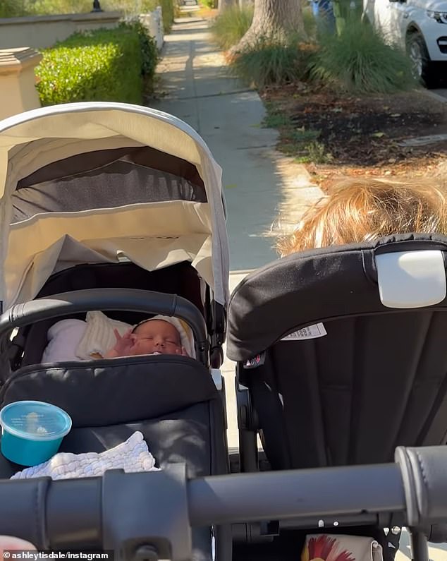 The proud mother posted a video of her two daughters being pushed in a double stroller.