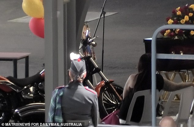 Members also parked one of Mr Martin's prized Harley Davidson motorcycles next to the coffin as the process took place.