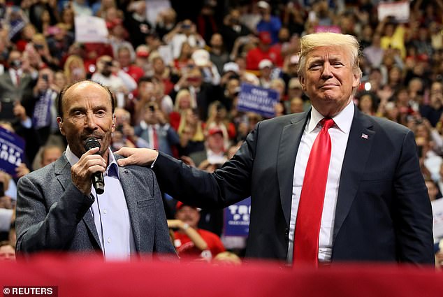 Donald Trump with country singer Lee Greenwood in November 2018: Greenwood's song God Bless the USA is Trump's music for his political rally.