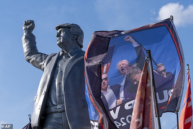 A statue of former President Donald Trump, Republican presidential candidate, is installed on a truck before a campaign event at the Butler Farm Show, Friday, Oct. 4, 2024, in Butler, Pennsylvania.