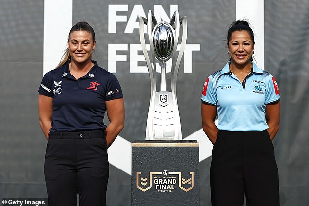 Jessica Sergis of the Gallos and Tiana Penitani of the Sharks with the NRLW trophy