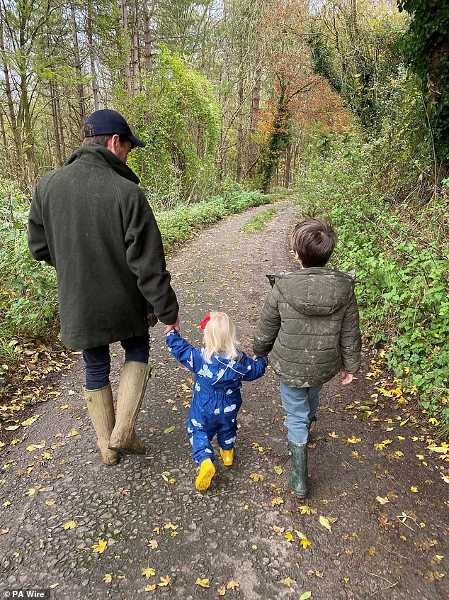 Beatrice, 36, shared a photo of Edo, Sienna and Wolfie walking in the woods.