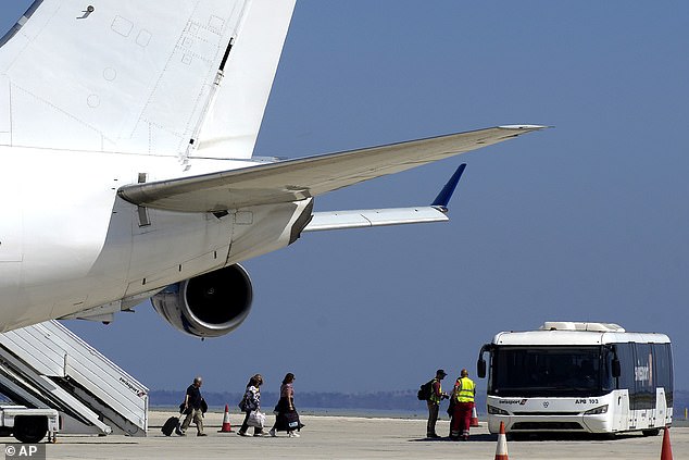 The government-organized flight is one of two on Saturday and will be followed by two on Sunday.