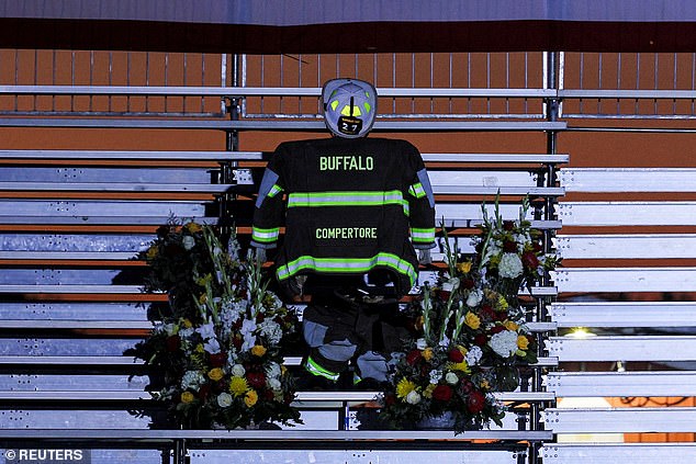 A memorial to Corey Comperatore, a retired volunteer fire department chief who was shot and killed in the July assassination attempt on Republican presidential candidate and former US President Donald Trump, on the day Trump returns to Butler, Pennsylvania , United States, on October 5, 2024.