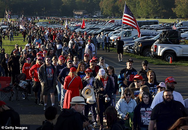 Attendees wait in line before a rally for Republican presidential candidate, former U.S. President Donald Trump, at the Butler Farm Show Inc. on October 5, 2024 in Butler, Pennsylvania. Trump holds rally in Butler at site of first assassination attempt