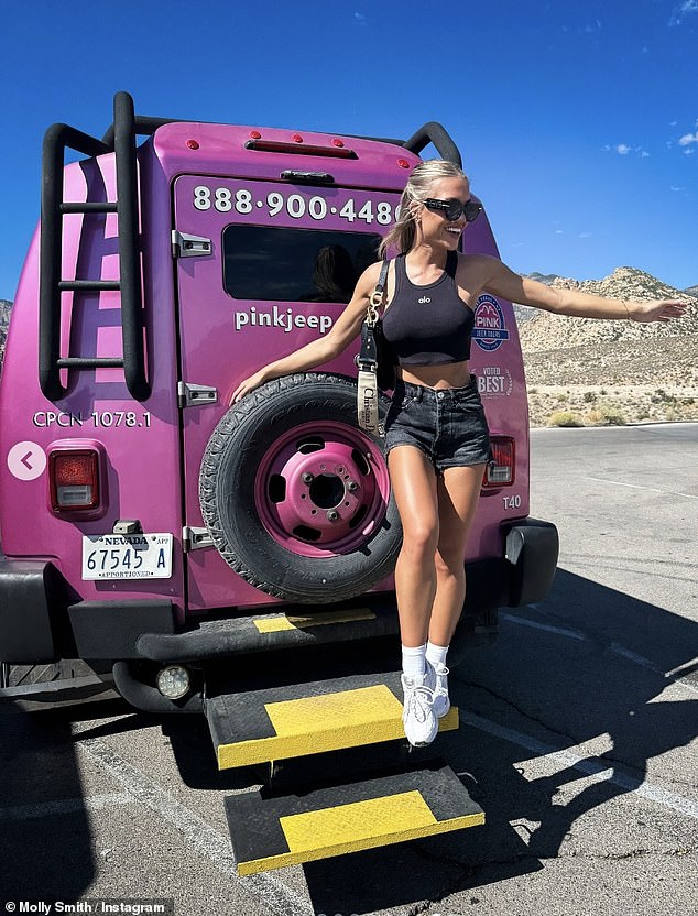 Posing up a storm in a pink Jeep, Molly looked in high spirits as she styled her blonde locks into a half-up, half-down hairstyle and sported a pair of cool black sunglasses.