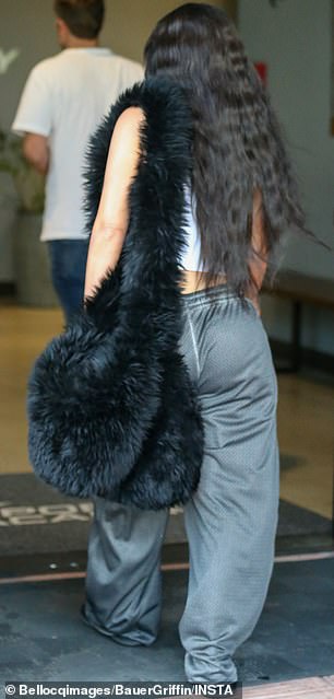 During her last outing, she carried a large, bulky, eye-catching black bag covered in what looked like faux fur.